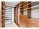 Spacious walk-in closet with custom shelving and drawers for optimal storage at 410 Acoma St # 309, Denver, CO 80204