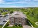 Aerial view of an apartment complex and surrounding green space at 10787 Twenty Mile Rd # 205, Parker, CO 80134