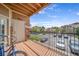 Exterior view from a balcony with railing overlooking the community parking lot at 10787 Twenty Mile Rd # 205, Parker, CO 80134