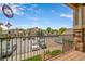 Exterior view from a balcony with railing overlooking the community parking lot at 10787 Twenty Mile Rd # 205, Parker, CO 80134