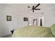 Bright bedroom featuring carpeted floors, ceiling fan, and access to a walkout patio at 10787 Twenty Mile Rd # 205, Parker, CO 80134