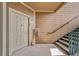 Condo entrance featuring a door with visible unit number and staircase at 10787 Twenty Mile Rd # 205, Parker, CO 80134