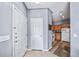 Entryway featuring tile flooring and views into the kitchen with stainless steel appliances at 10787 Twenty Mile Rd # 205, Parker, CO 80134