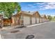 Row of detached garages along a paved driveway at 10787 Twenty Mile Rd # 205, Parker, CO 80134