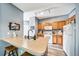Kitchen with island, cabinets, ample counter space and modern lighting at 10787 Twenty Mile Rd # 205, Parker, CO 80134