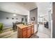 Open-concept kitchen island with sink, dishwasher and with a view into the living room at 10787 Twenty Mile Rd # 205, Parker, CO 80134