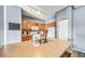Kitchen island features double sink, adjacent to cabinets, refrigerator and stove at 10787 Twenty Mile Rd # 205, Parker, CO 80134