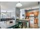 Open living space showcases seamless integration of the living room, dining area, and kitchen at 10787 Twenty Mile Rd # 205, Parker, CO 80134
