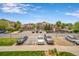 Community parking lot with water features, landscaping, and multiple buildings at 10787 Twenty Mile Rd # 205, Parker, CO 80134