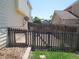 A fenced back yard has a small gate for access to the rest of the property at 19421 E Evans Dr, Aurora, CO 80013