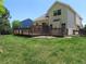 Expansive backyard with a spacious wooden deck, perfect for outdoor entertaining and relaxation at 19421 E Evans Dr, Aurora, CO 80013