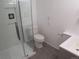 Bright bathroom featuring a glass-enclosed shower, modern fixtures, and a sleek vanity at 19421 E Evans Dr, Aurora, CO 80013