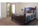 Cozy main bedroom features a queen-size bed, ensuite bathroom, and walk-in closet at 19421 E Evans Dr, Aurora, CO 80013