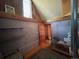 Attic area featuring a vintage window and a wood beam ceiling at 2602 Jasmine St, Denver, CO 80207
