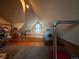 Charming attic room with wood floors, floral accents, and cozy feel at 2602 Jasmine St, Denver, CO 80207