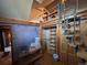 Unique attic space with spiral staircase, shelving, and rustic charm at 2602 Jasmine St, Denver, CO 80207