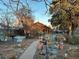 Charming backyard with a garden featuring raised beds and a stock tank pool at 2602 Jasmine St, Denver, CO 80207