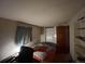 Cozy bedroom featuring a neutral color palette and a closet with sliding doors at 2602 Jasmine St, Denver, CO 80207