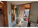 Entryway leading to a sunroom with natural light and access to the outdoors at 2602 Jasmine St, Denver, CO 80207
