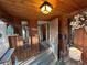 Inviting entryway featuring wood paneled walls and decorative lighting at 2602 Jasmine St, Denver, CO 80207