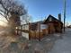 Wooden exterior with a metal fence and view from the back alley at 2602 Jasmine St, Denver, CO 80207