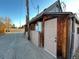 Exterior of the home featuring wood siding and a side entrance at 2602 Jasmine St, Denver, CO 80207