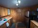 Functional kitchen with stainless steel appliances, wood cabinets, and ample counter space at 2602 Jasmine St, Denver, CO 80207