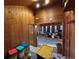 Spacious living room featuring beautiful wood paneling and an open layout perfect for entertaining at 2602 Jasmine St, Denver, CO 80207