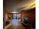 Bright living room featuring hardwood floors, a cozy fireplace, and ample natural light, ideal for gatherings at 2602 Jasmine St, Denver, CO 80207
