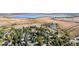 Expansive aerial view of community with nearby lake, capturing the scenic beauty of the neighborhood at 5432 S Dayton Ct, Greenwood Village, CO 80111