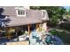 Aerial view of backyard, with a patio, outdoor kitchen, fire pit, and lounge area at 5432 S Dayton Ct, Greenwood Village, CO 80111