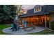 Inviting backyard patio with a fire pit and seating, perfect for relaxing evenings at 5432 S Dayton Ct, Greenwood Village, CO 80111