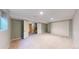 Spacious basement bedroom with a large closet, neutral carpet, and access to the staircase at 5432 S Dayton Ct, Greenwood Village, CO 80111