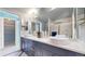 Bathroom features double sinks, a large mirror, and a walk-in closet at 5432 S Dayton Ct, Greenwood Village, CO 80111