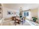 Elegant dining room featuring a modern light fixture, stylish decor, and large windows for plenty of light at 5432 S Dayton Ct, Greenwood Village, CO 80111