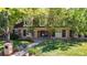 Charming two-story brick home with well-maintained lawn and mature trees providing shade and curb appeal at 5432 S Dayton Ct, Greenwood Village, CO 80111