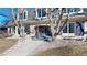 Charming two-story brick home with manicured landscaping, dark shutters, and a stone walkway at 5432 S Dayton Ct, Greenwood Village, CO 80111