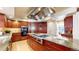Gourmet kitchen with granite countertops, stainless steel appliances, cherry cabinets, and a chef's stove at 5432 S Dayton Ct, Greenwood Village, CO 80111