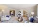 Bright and airy living room with neutral tones and multiple doorways, creating an open and inviting space at 5432 S Dayton Ct, Greenwood Village, CO 80111