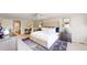 Bright main bedroom features a walk-in closet, ceiling fan, desk, and nightstands at 5432 S Dayton Ct, Greenwood Village, CO 80111