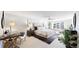 Serene bedroom featuring a tufted headboard, natural light, and a cozy window seat at 5432 S Dayton Ct, Greenwood Village, CO 80111