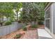 Landscaped backyard featuring garden beds and a private patio at 1633 S Trenton St, Denver, CO 80231