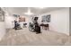 Finished basement features workout equipment on a patterned carpet creating a comfortable fitness area at 1633 S Trenton St, Denver, CO 80231