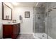 Updated bathroom with glass shower, modern fixtures and vanity at 1633 S Trenton St, Denver, CO 80231