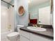 Cozy bathroom with a combined shower and tub, plus a decorative accent piece on the wall at 1633 S Trenton St, Denver, CO 80231