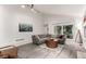 Relaxing living room featuring a corner sofa, city skyline art, and a modern aesthetic at 1633 S Trenton St, Denver, CO 80231