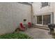 Private outdoor patio space with room for seating and potted plants at 1633 S Trenton St, Denver, CO 80231