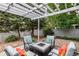 Outdoor patio with comfortable seating and a charming pergola at 1633 S Trenton St, Denver, CO 80231