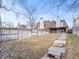 Backyard view of the house showing brick and siding, along with a stepping stone walkway at 2323 S Jamaica St, Aurora, CO 80014