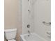 Tiled bathroom with a shower-over-tub, toilet, and vanity at 2323 S Jamaica St, Aurora, CO 80014